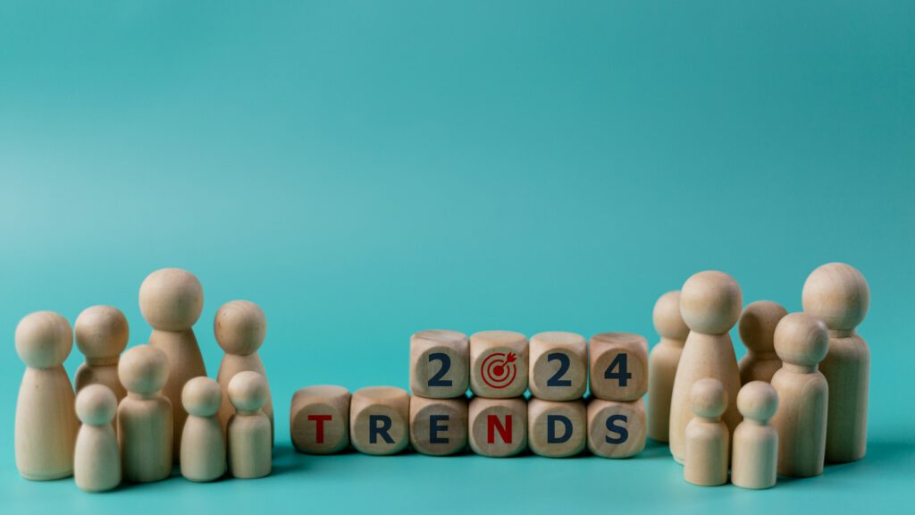 2024 Action Plan. Wooden figures of people and wooden cubes with the word Trends 2024
